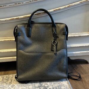 Tumi Women’s Gray and Black Briefcase Backpack with padded jewelry pocket